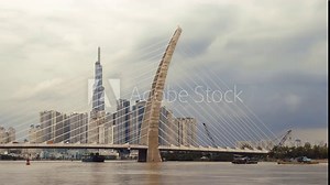 Ho Chi Minh City (Saigon), Vietnam - September 2, 2023: Skyline of the city with the Ba Son Bridge over the Saigon River and Landmark 81 building in the distance