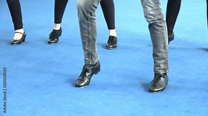 Legs of tap dancers moving and tapping live performance at theatre. Close up of dancing feet, shiny light on blue carpet, 50s music. Vintage dance style, art, sport and musical culture Stock Video