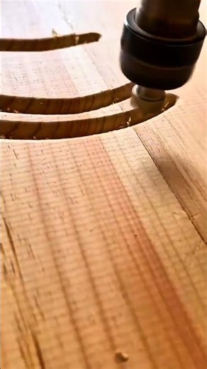 shaping the surface of a wooden block using a sharp manual chisel tool to level the timber today