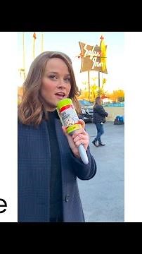 Reese Witherspoon practices her reporting skills on the set of The Morning Show