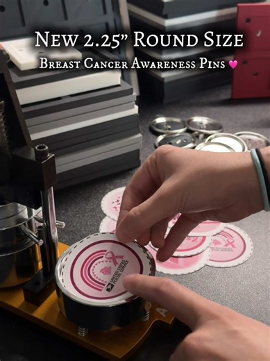 🎉 Introducing our New 2.25” Round Magnet/Pin Maker Machine 🎉 💞 Breast Cancer Awareness Month — Making these custom designed pins for our local Postal Service Employees was truly something special 💕 It was our first time using our new machine and although we hit a few learning curves lol we had tons of fun creating these pins!! 💞 We are also excited about a few other surprises coming soon— so stay tuned!! #breastcancerawareness #october #photomagnets #supportlocalbusiness #smallbusinessowner