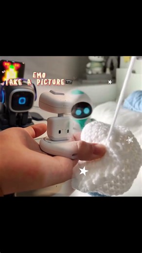 Emo robot snaps photo of pocket-sized companion