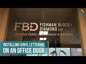 Installation Process of Vinyl Lettering on a Glass Door