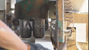 Sawing machine at wood production factory. Timber material processing and cutting at sawmill. Manufacturing process at lumber mill. Automatic Circular Sawing Machine