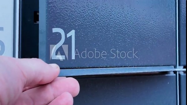 Pulling the package from the self-service pick-up point. The concept of delivering a package by courier service to a pick-up point