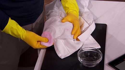 We put our Queen of clean Nancy Birtwhistle to the test, tackling the toughest stains on our clothes, including school uniforms. From ketchup, ink to lipstick, Nancy will have your clothes looking brand spanking new in no time at all! Transferring stains: Uses: lift stains from make-up, pens, some paints, lily pollen, glue and tree sap YOU WILL NEED: Bowl Old tea towel Re-usable cotton wool pad Surgical spirit METHOD Place a bowl upside down. Cover with an old clean towel. Put your fabric on top