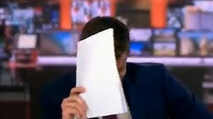 BBC newsreader forced to HIDE live on air because he's so frightened