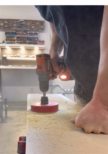 Drilled my display floor with a 4 3/4” hole saw from @Diablo Tools to finally add a turn table 🤘🏼 This has been on the to do list for a long time! The turn table from @Temu is battery powered or wired. I opted to plug mine in so I could turn it on and off with the remote I have for the whole cabinet. My angle grinder cut off disc is temporary 😅 I have to get to a planer to skim down a piece to shim up the turn table. Repainted the top board at CSN Collision to ensure a clean finish ✨ Super st