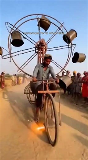 Man Rides DIY Ferris Cycle with Fire-Powered Pedals