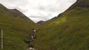 Flying over the scottish Highlands in Glen Coe in Scotland - 4K Drone Video