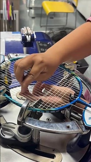 Restringing a badminton racket with a high-tension electronic stringing machine