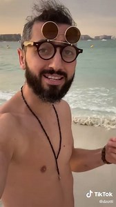 Beach Vibes: Shirtless Male Enjoys Coastal Views