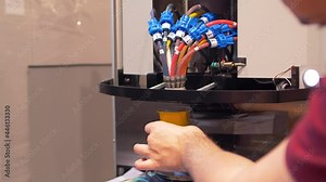 Process calibration of the new automatic dispenser. Colorant dispenser nozzle.