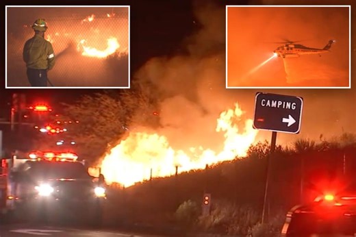 Firefighters make progress against fast-moving blaze along highway north of Los Angeles