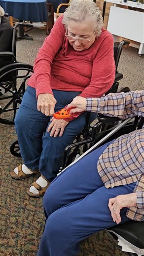 We love fun and challenging activities! Residents raced against another team to see who filled the bucket first! | Edenbrook of Platteville
