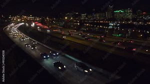 Good footage of freeway or highway traffic at night with the Portland Oregon city skyline background.