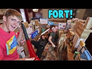 Opening Fan Mail Inside a Fort of Mail