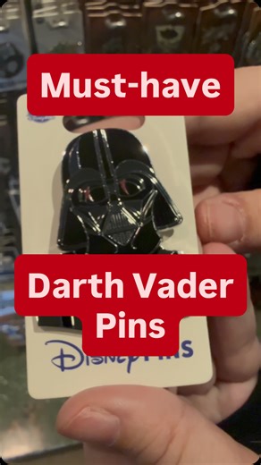 Check out these incredible Dark Side finds at the Star Wars Trading Post! 🖤 First up is a unique Darth Vader slider pin—the helmet lifts to reveal Anakin Skywalker underneath. ⚔️ Also spotted is a stunning light-up Vader lightsaber set against the Imperial logo. 🔴✨ These detailed pins are a must-have for any Sith collector! Which one are you adding to your lanyard? 🏴‍☠️ #DarthVader #DisneyPins #disneyland | Galaxy's Edge Explorers