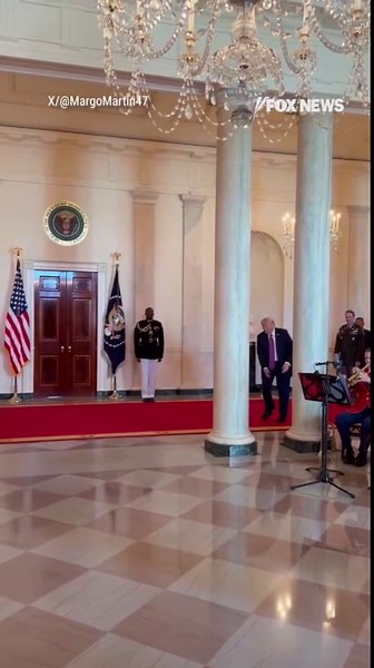 Trump greets Oklahoma State men's golf team with golf swing