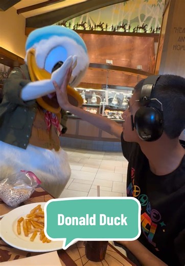 Donald Duck giving Thomas a fist bump at Donald’s Tales of Adventure #autism #disneyland #characterdining #donaldduck #donaldstalesofadventure