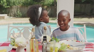 Happy family eating together at table Free Stock Video Footage