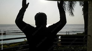 Fatty man doing stretches to prepare for his workout, near swimming pool, Seaside