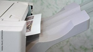 Printer breakdown, a sheet of paper does not come out of the tray, stuck Printing error, office equipment repair Close-up Breakdown of home copying equipment, printing of counterfeit money, banknotes