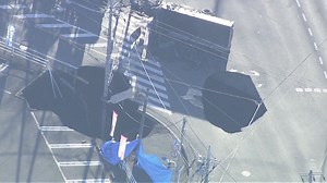 Watch sinkhole swallow sign during rescue mission in Japan