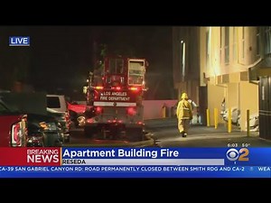 Large fire breaks out in Reseda apartment complex, man critically hurt