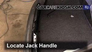 Replace Flat Tire with Spare Tire: 1986 Peugeot 205 GL 1.1L 4 Cyl.