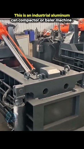 An industrial aluminum can baler or compactor machine