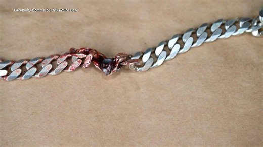 Man dodges bullet with chain, police say