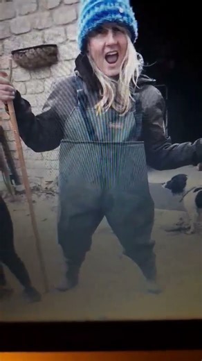 woman wearing waders near pond cleanup session chesties chestwaders rubber protection