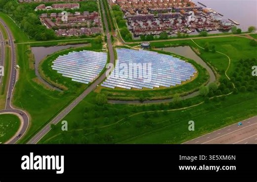 Aerial view of modern residential city Almere. Netherlands. City with solar panels island providing city heating Stock Video Footage - Alamy