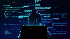 Futuristic Hacker Typing on Laptop with Abstract Code Overlay