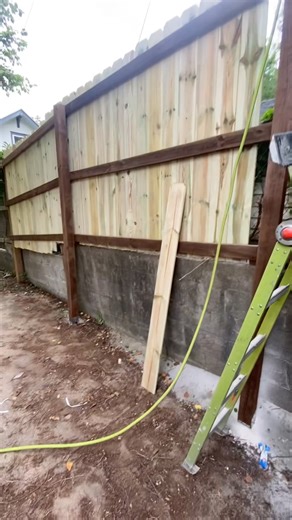 Putting up a privacy fence with a surprise inspection from the neighbor