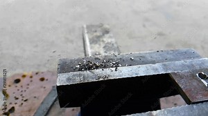 Metal shavings on the machine, slow motion, close up