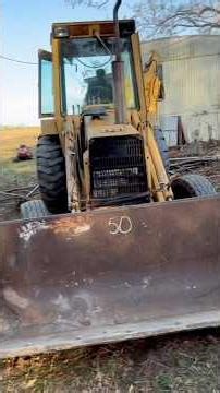 Ford 555b pulling tree stumps and clearing land. Destroy the trailer? #ford #backhoe