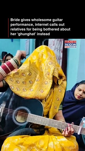 A video of a new bride singing while playing the guitar, surrounded by her relatives, has gone viral and left netizens divided. While many praised her talent and the wholesome moment, others criticised the relatives for focusing more on her ghunghat than her performance. [Viral, guitar] #tntrendingnow | TIMES NOW