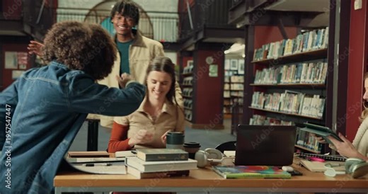 Students, friends and greeting with hug in library for welcome, handshake or study group. Education, gen z people and embrace at university for assignment support, morning routine and class tutorial