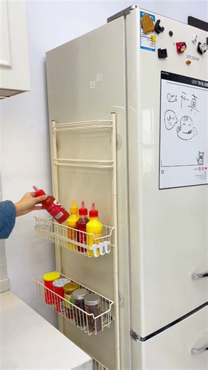 Smart Home Gadgets on Instagram: "Comment “YES” if you need more space in your fridge 😍👇 Who knew that tiny space could store SO MUCH?! This genius sliding rack slips into the narrowest corner, keeps everything tidy, and glides quietly with its double-rail design 😍 From clutter to ahhh… satisfaction! in seconds 🙌 #RefrigeratorSideShelf #RefrigeratorStorageRack #KitchenStorageRack #GapStorageRack #Shelves #KitchenStorage"