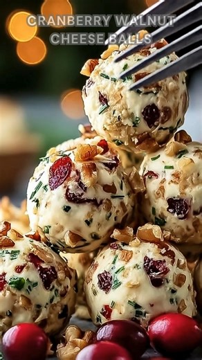 227K views · 2.9K reactions | Cream cheese whipped with sharp cheddar, garlic, and onion powder. Fold in cranberries and parsley, roll in walnut-cranberry coating. Chill 30 minutes creamy, tangy, and perfectly festive with a nutty crunch. Ingredients ➤ 8 oz cream cheese, softened ➤ 1 cup sharp white cheddar, shredded ➤ ¼ tsp garlic powder ➤ ¼ tsp onion powder ➤ Pinch of black pepper FULLL Recipe in First Cօʍʍеոτ  | Nessy Recipes | Facebook