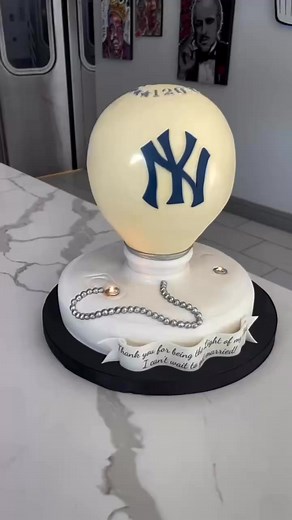 Made a cake for a groom who is legally blind, and has collected lightbulbs since he’s a kid , also huge Yankee fan. here’s how it came out #groomscake | The Cake Don