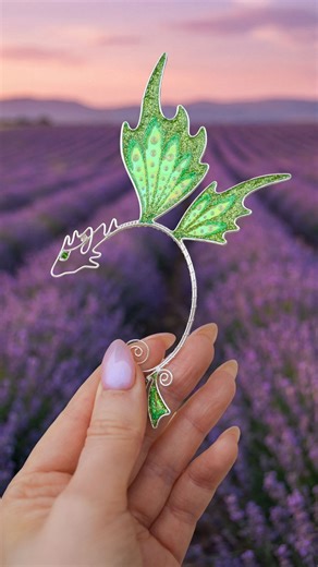 Ear cuffs • 925 Silver • Handmade • Elf jewelry on Instagram: "I’ve just finished a new batch of these dragons and I’m sending them to my US warehouse now. So they’ll be available to order with shipping from the US very soon. Fantasy dragon ear cuff is made of silver-plated copper wire and Angelina film. Adjustable to any ear size, no piercing needed. All links are in bio."