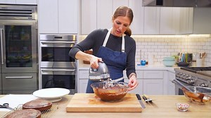 Get our tips and tricks for stacking and frosting a beautiful, professional-looking cake every time. Get the recipe: https://trib.al/8dMIHus | Real Simple