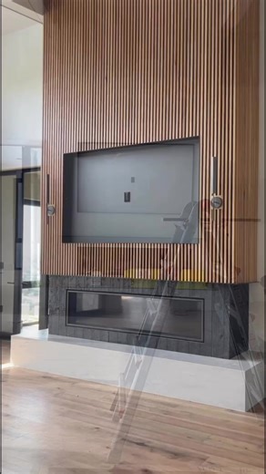 Imagine Your Dream Fireplace Taking Shape… 🔥✨ From bare foundations to a breathtaking focal point, watch as this brand-new fireplace is constructed from the ground up! Custom wood paneling, elegant lighting, and a built-in TV mount—every detail is crafted to perfection. Ready to see how it all came together? #fireplacedesign #utahdesigncenter #utahhomes #newconstruction #dreamhome #customwoodwork ##homeinspo #fireplace #interiordesign