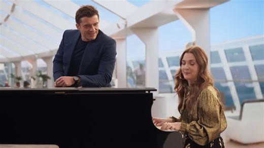 Drew Barrymore sings in Super Bowl ad with Orlando Bloom
