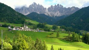 Dolomites Italy landscape at Santa Maddalena or St. Magdalena village at foot of Ruefen Mountain. The beautiful mountain landscape attracts tourist to Dolomites travel in Northern Italy.