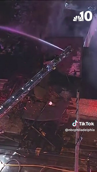 Fire crews watched as a property crumbled to the ground in Camden, New Jersey, early Wednesday, as firefighters worked to put out flames at the building. NBC10's SkyForce10 captured the moment the roof of the structure collapsed into itself as crews worked at the scene along the 1600 block of South 6th Street in Camden, NJ, at about 6:15 a.m. on Wednesday. According to officials, the fire was placed under control shortly after the building collapse and no firefighters were hurt in the incident. 