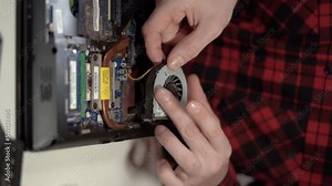 Dust and dirt on computer fan. Fixing laptop. Disassembling and cleaning notebook cooling system. Close up.